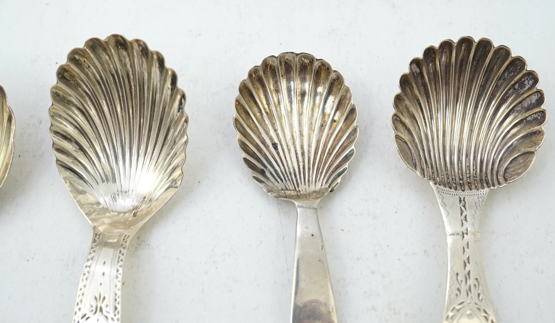 Ten assorted mainly 19th century silver and white metal caddy spoons, with shell or fluted bowls